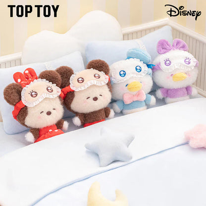 Four plush toys in a crib with 'Top Toy' and 'Disney' branding.