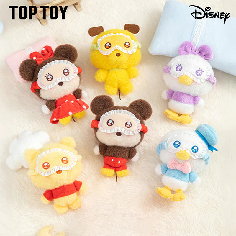 Collection of small plush toys with cartoon designs on a light background, featuring the brand 'TopToy' and Disney logo.