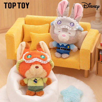 Two plush toys, one orange and one gray with pink ears, on a yellow couch with 'Top Toy' and 'Disney' branding.
