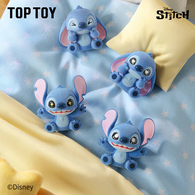 Four blue cartoon characters resembling a famous animated character on a light blue background with 'Top Toy' and 'Disney Stitch' branding.