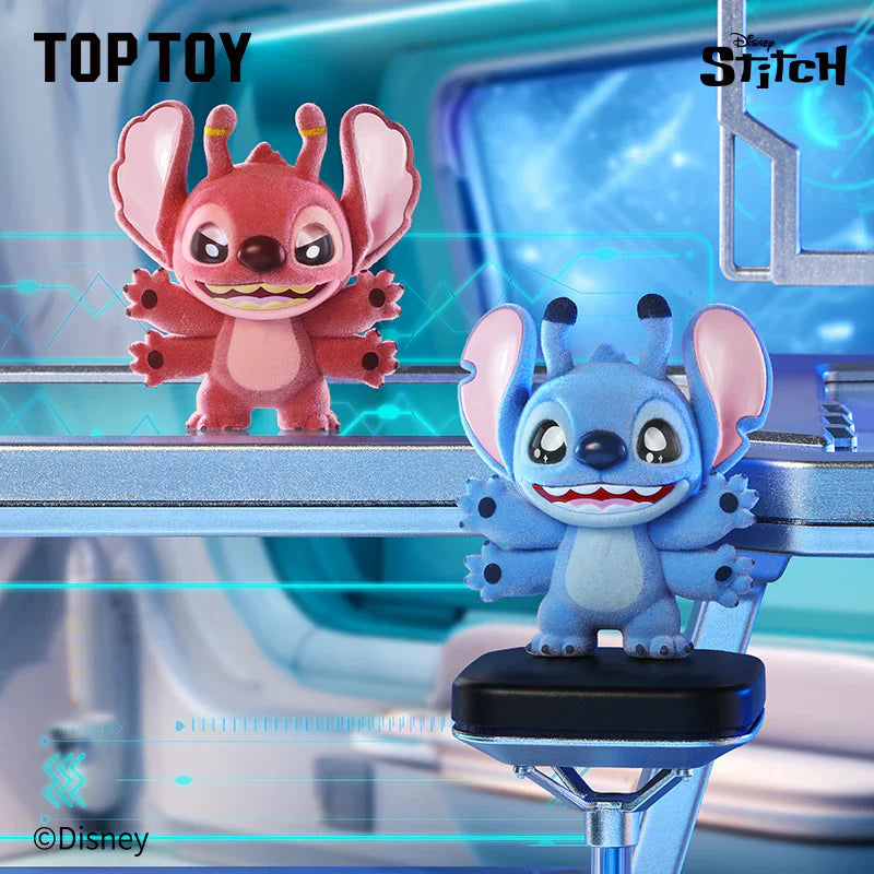 Two animated toy figures of a pink and blue character on a futuristic background with 'Top Toy' and 'Disney' branding.