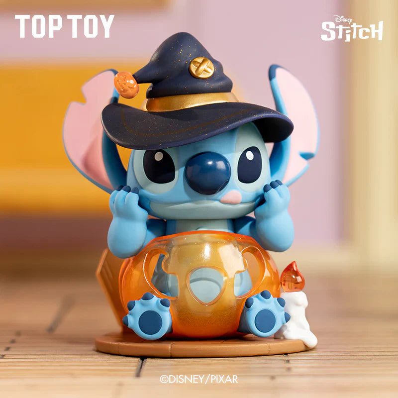 Toy figure of a character from Disney/Pixar with a witch hat and pumpkin, labeled 'Top Toy'.