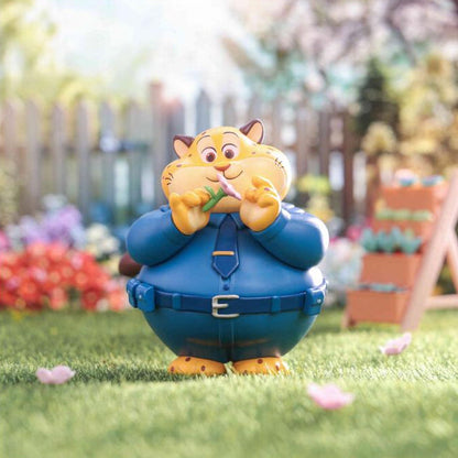 Animated character figurine in a garden setting