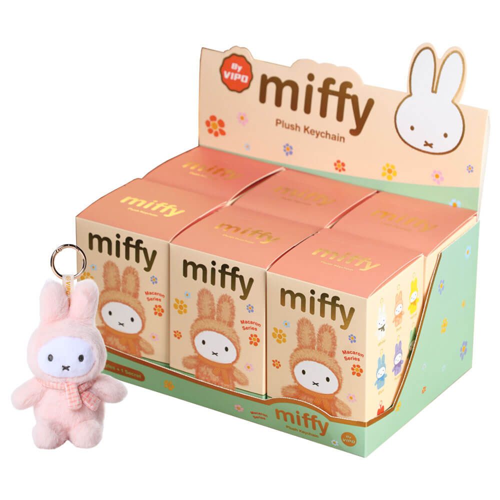 Display box of Miffy plush keychains with a pink Miffy keychain in front.